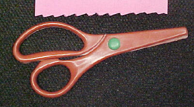 red plastic scrapbooking scissors - jagged edge