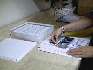 Placing and attaching picture halftones on manuscirpt pages by hand - individual attention to detail