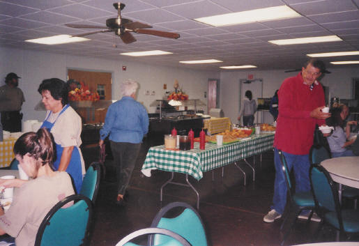 Family style dining snapshot from Genealogy in the Woods 2003 Retreat